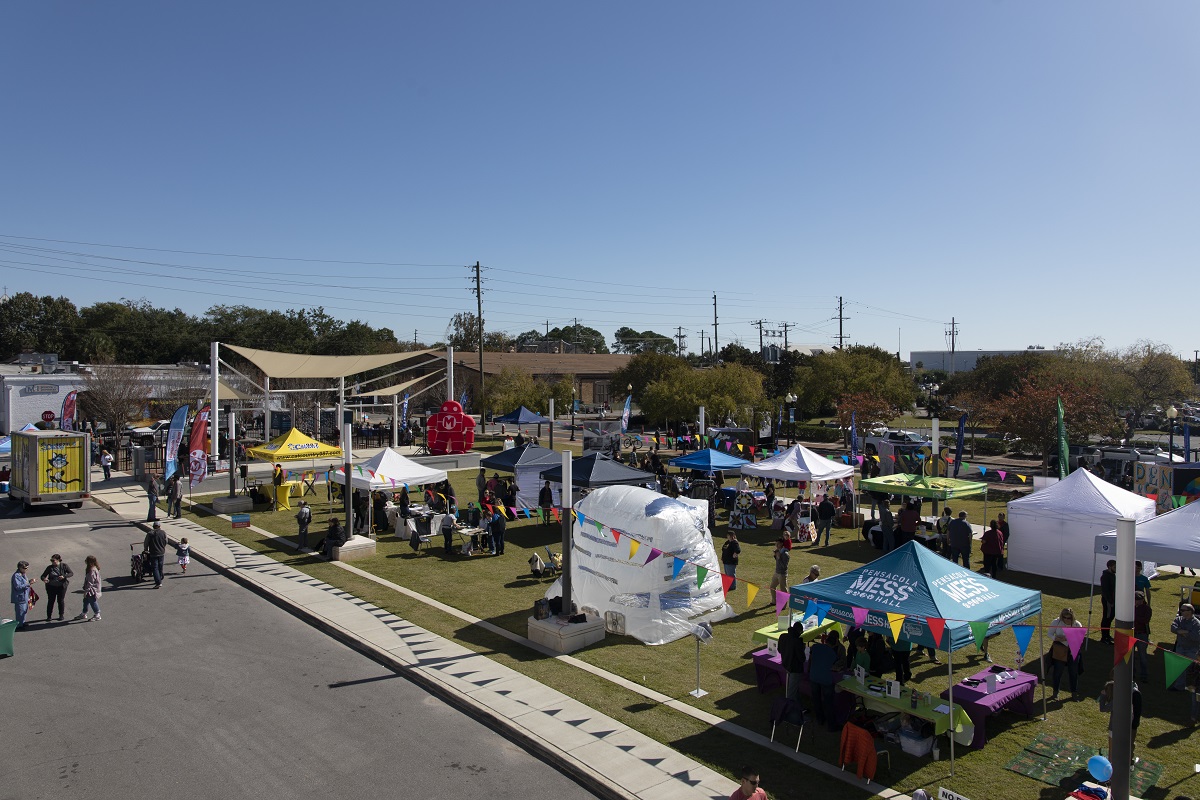 Photos of tents on museum plaza for Makers Faire